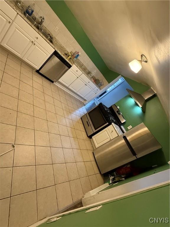 kitchen featuring white cabinetry