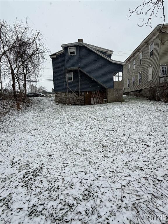 view of snow covered house