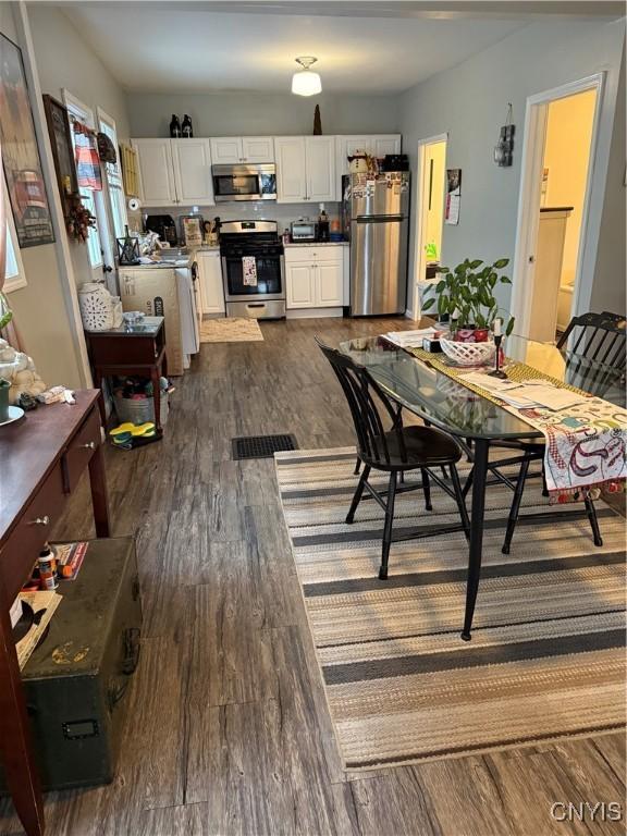 dining room featuring dark wood-type flooring