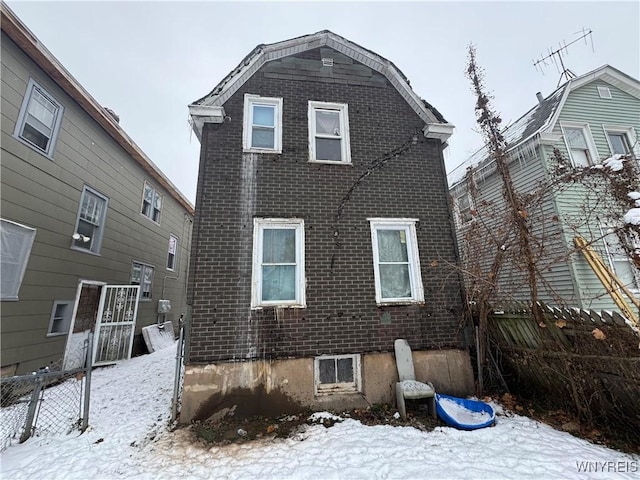 view of snow covered house