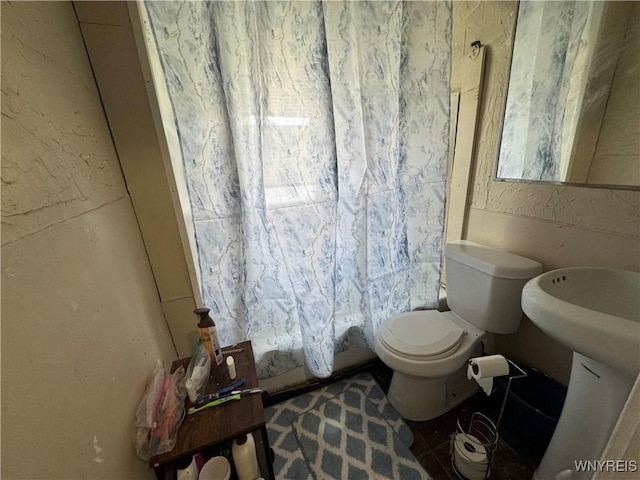 bathroom featuring toilet