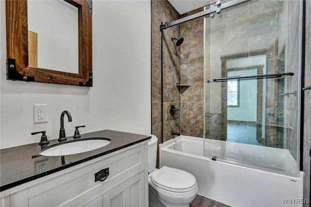 full bathroom with vanity, toilet, and enclosed tub / shower combo