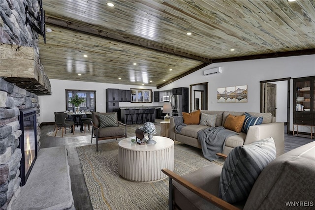 living room featuring a stone fireplace, vaulted ceiling with beams, an AC wall unit, concrete floors, and wood ceiling