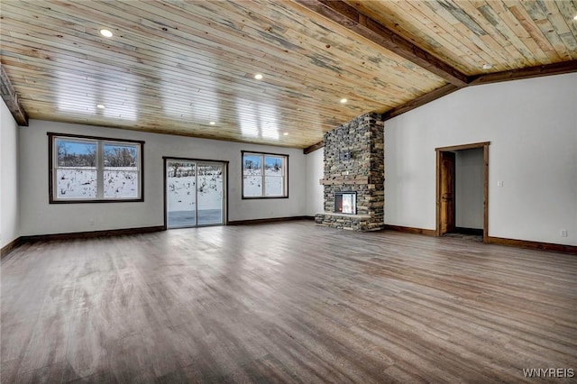 unfurnished living room with vaulted ceiling with beams, a fireplace, wood ceiling, and wood-type flooring