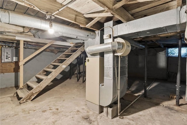 basement with electric panel and heating unit