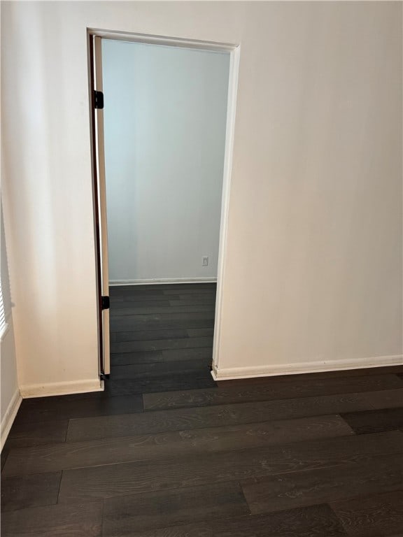 spare room featuring dark hardwood / wood-style floors