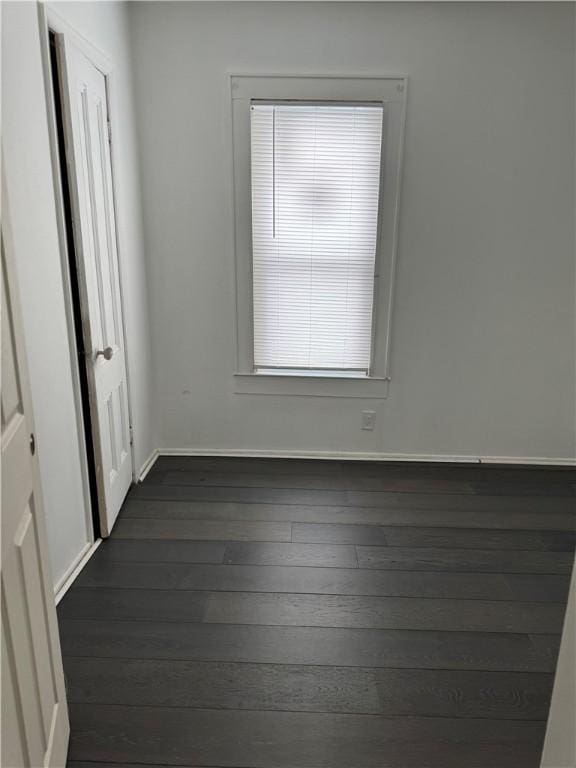 spare room featuring dark hardwood / wood-style flooring