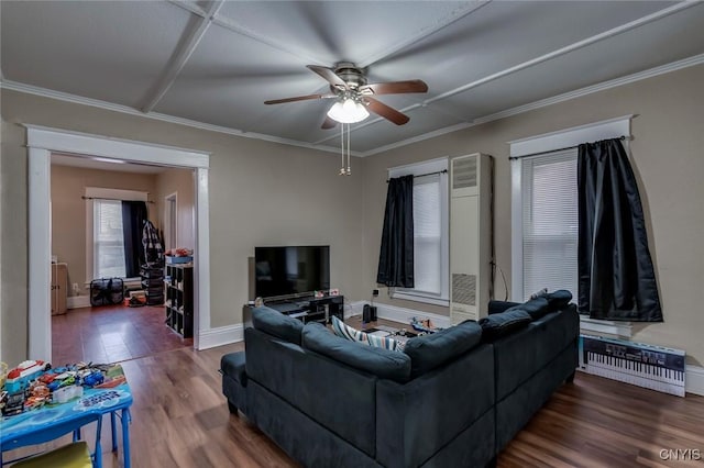 living room featuring ceiling fan, ornamental molding, and hardwood / wood-style flooring