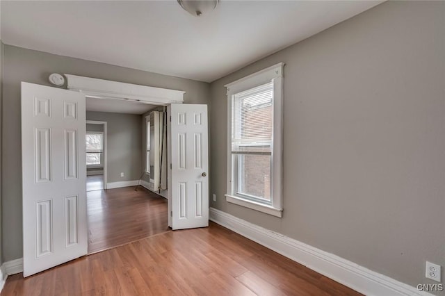 spare room featuring light hardwood / wood-style floors