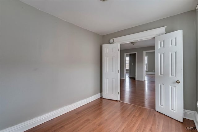 empty room featuring hardwood / wood-style flooring