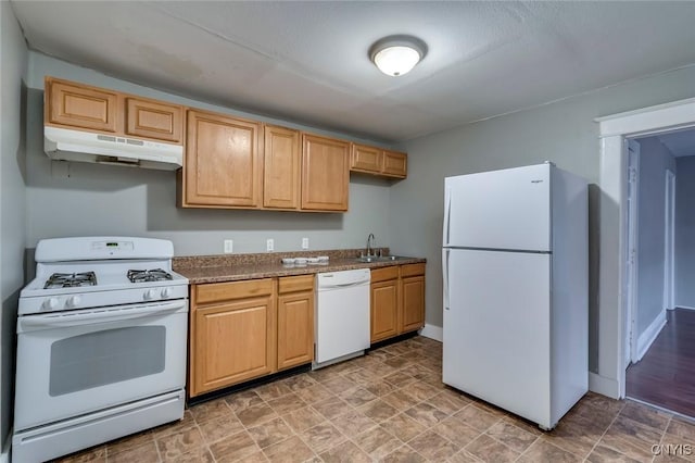 kitchen featuring white appliances and sink