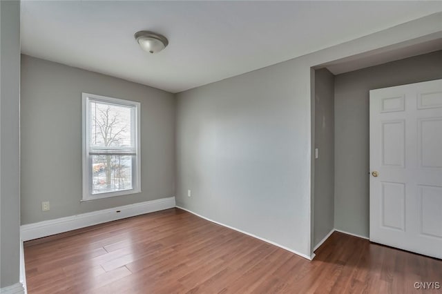 spare room with hardwood / wood-style flooring