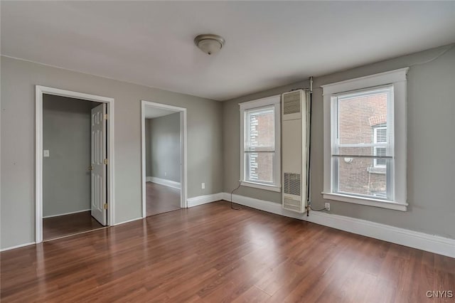 spare room featuring dark hardwood / wood-style flooring