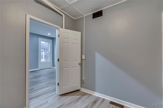 spare room featuring light hardwood / wood-style floors