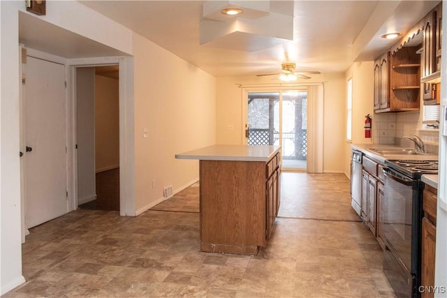 kitchen featuring ceiling fan, sink, dishwasher, black electric range, and a kitchen island