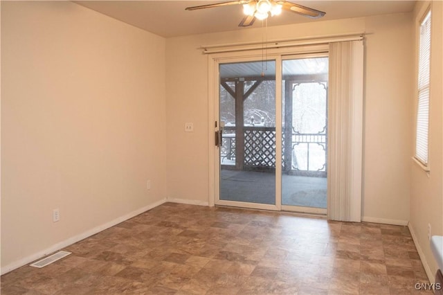 unfurnished room with ceiling fan