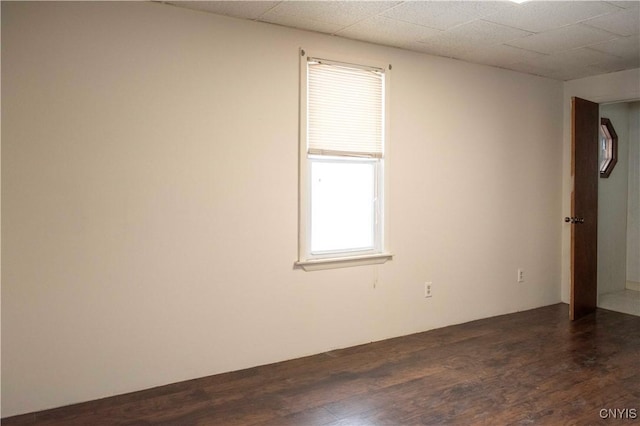 spare room with dark hardwood / wood-style floors