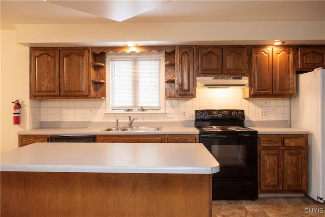 kitchen with black appliances, decorative backsplash, and sink