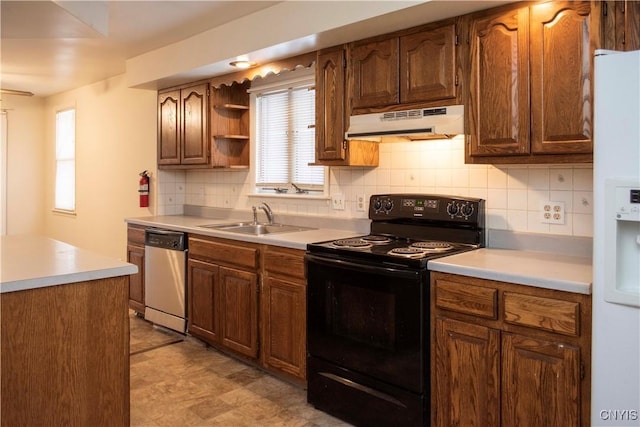 kitchen with decorative backsplash, sink, white refrigerator with ice dispenser, dishwasher, and black / electric stove