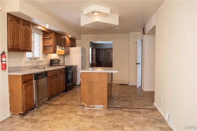 kitchen with sink, dishwasher, black electric range oven, decorative backsplash, and a kitchen island