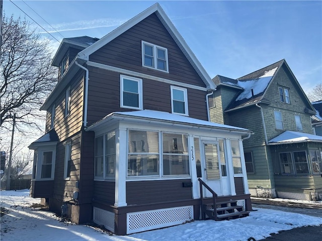 front of property featuring a sunroom