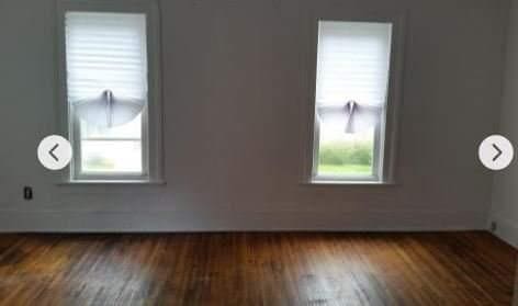 bonus room featuring dark hardwood / wood-style floors