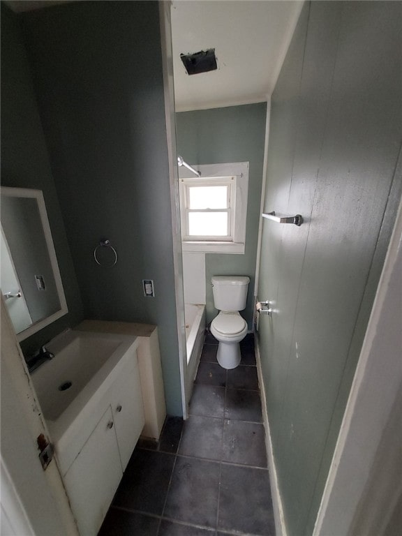 bathroom featuring tile patterned flooring, vanity, and toilet