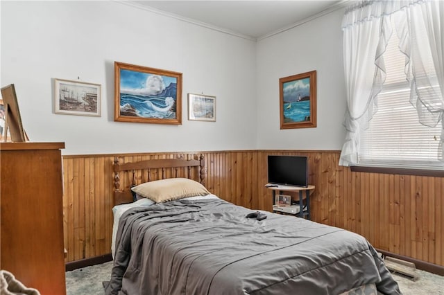 carpeted bedroom with ornamental molding