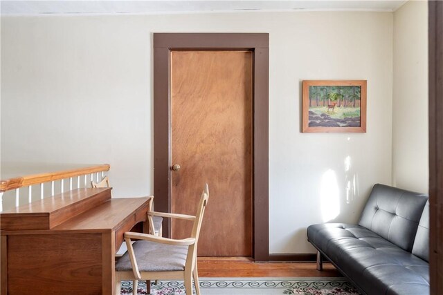 office area with light hardwood / wood-style floors