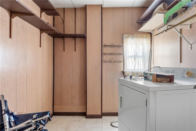 laundry room with washer / dryer and wooden walls