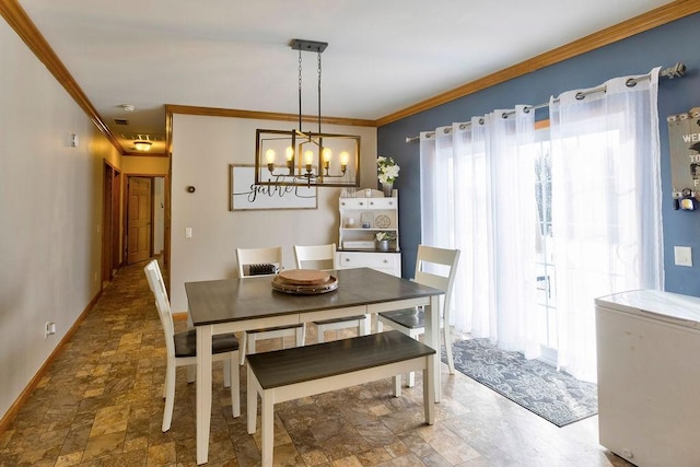 dining area featuring a notable chandelier and ornamental molding