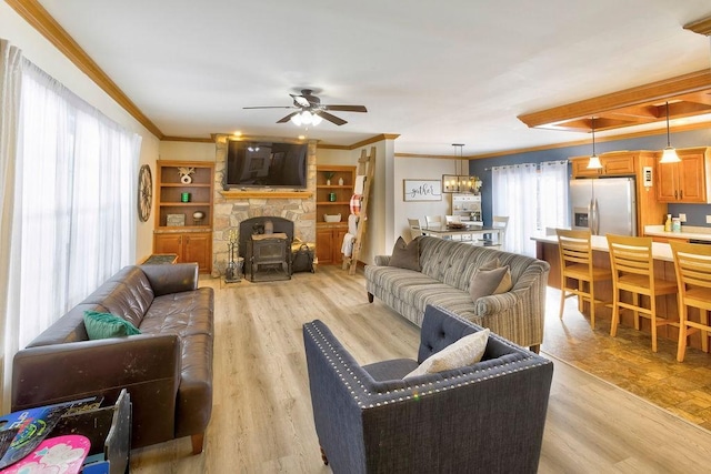 living room featuring crown molding, ceiling fan, and light wood-type flooring