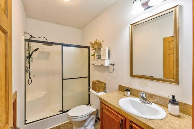 bathroom with vanity, toilet, and walk in shower