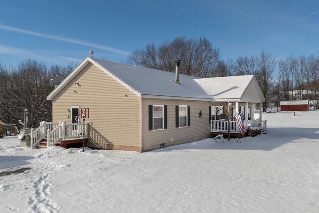 view of snow covered house