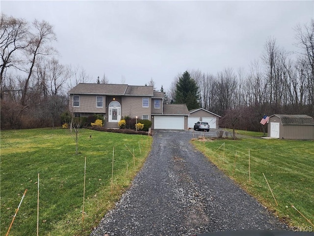 bi-level home featuring a front lawn, an outdoor structure, a detached garage, and a storage shed