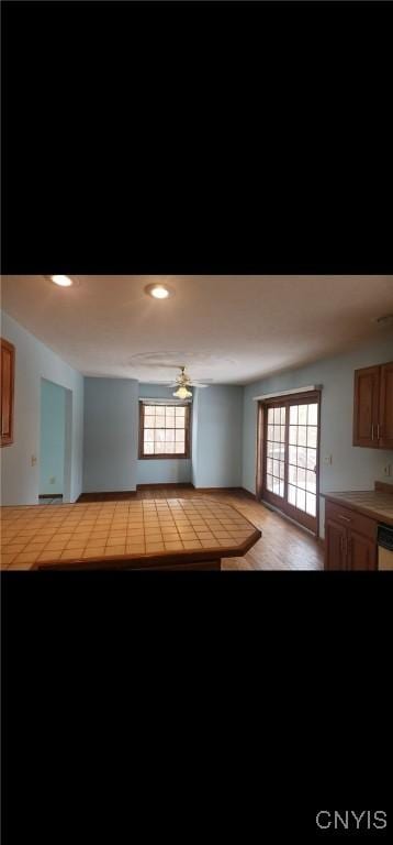 interior space featuring ceiling fan and recessed lighting