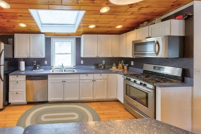 kitchen featuring stainless steel appliances and white cabinetry