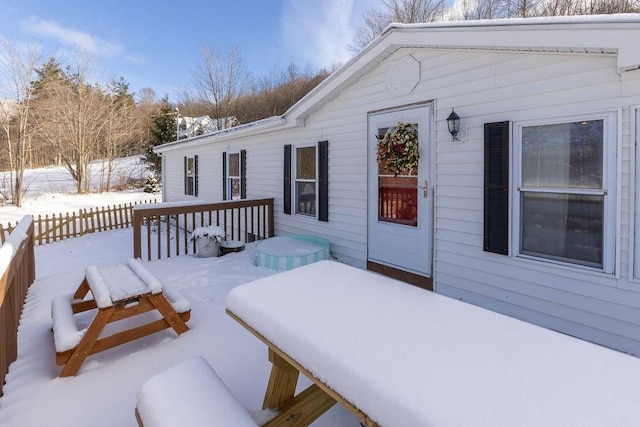 view of snow covered deck