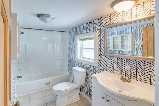 bathroom with toilet, vanity, shower / bathtub combination, and tile patterned floors