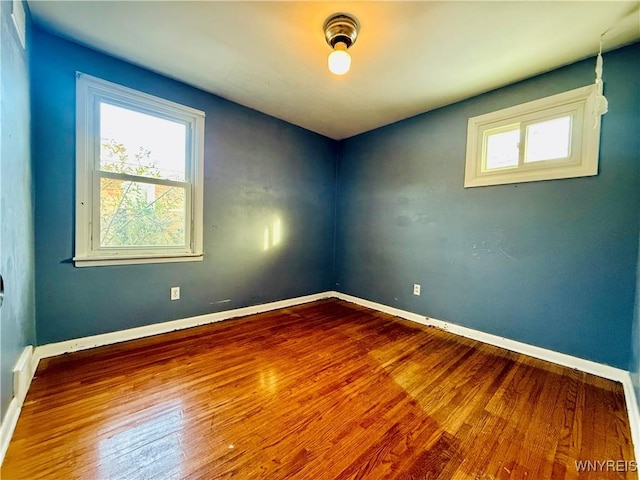 spare room featuring hardwood / wood-style floors