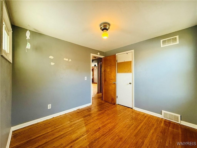 spare room featuring light hardwood / wood-style floors