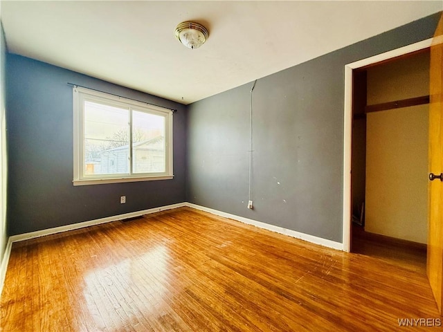 spare room featuring hardwood / wood-style flooring