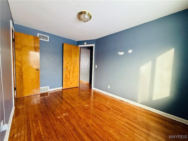 unfurnished bedroom featuring wood-type flooring