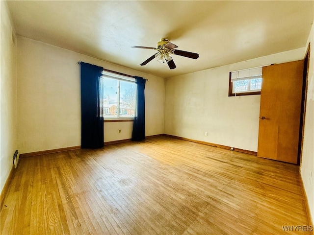 spare room with ceiling fan and wood-type flooring