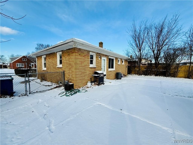 view of snow covered house