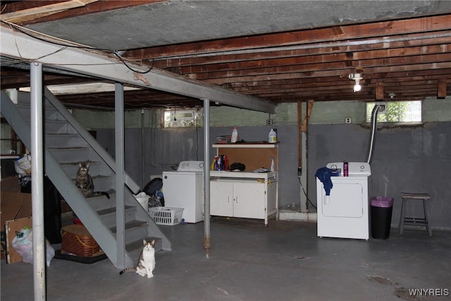 basement featuring washing machine and clothes dryer