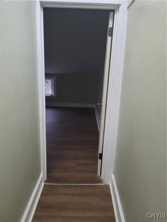 hall with dark wood-type flooring