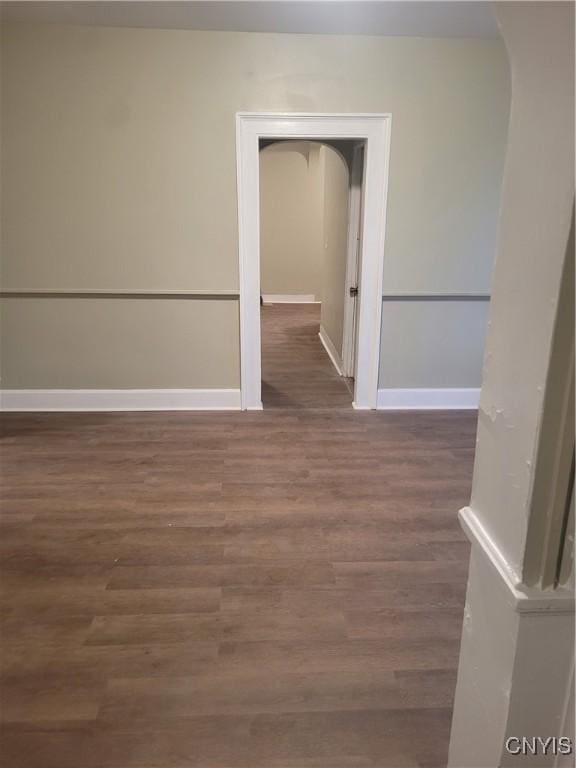 unfurnished room featuring dark hardwood / wood-style floors