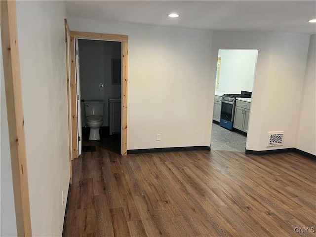 empty room with hardwood / wood-style floors