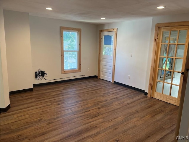 spare room featuring dark wood-type flooring